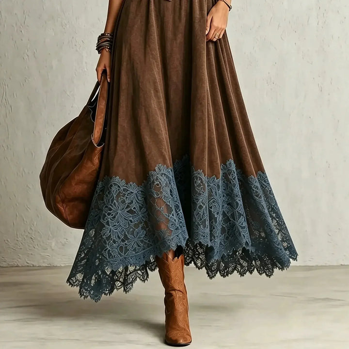 Close up of lace hem detail on brown maxi dress