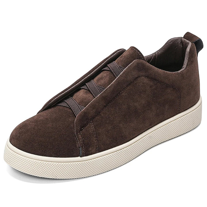 Brown suede-look sneaker side angle view on white background