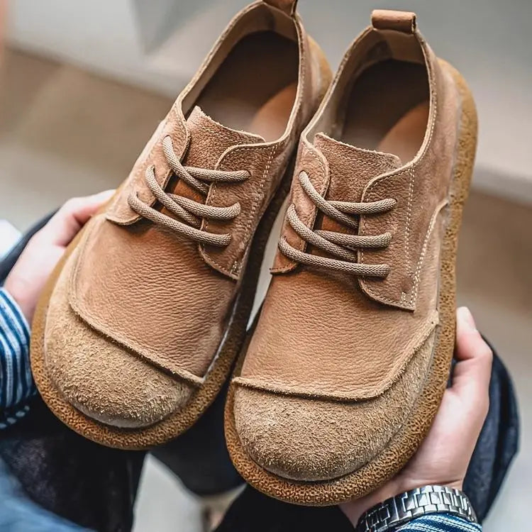 Khaki lace up shoes viewed from above