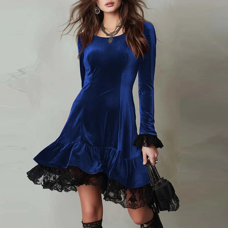 Woman wearing blue velvet mini dress with ruffled lace hem