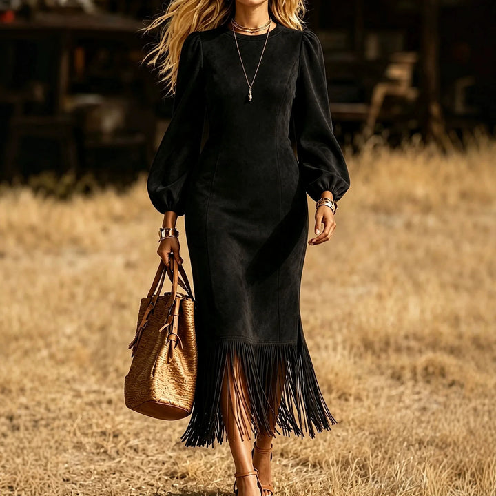 Black faux suede fringe hem midi dress close up with lantern sleeves