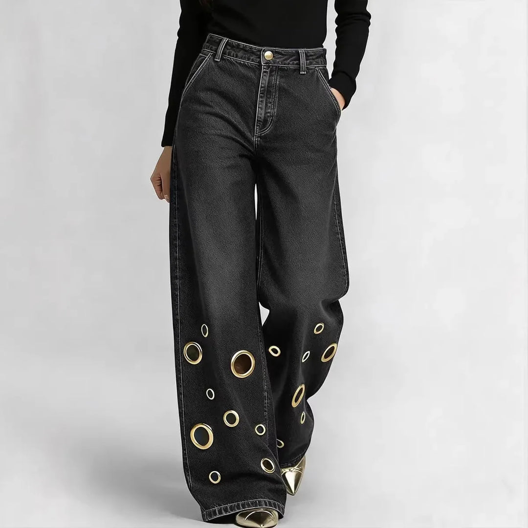 Wide leg jeans with grommet cutouts in black, front view