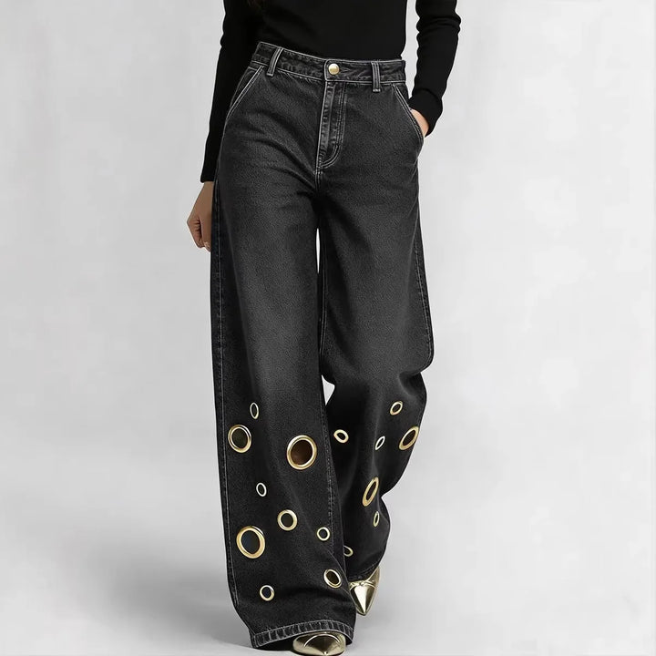 Wide leg jeans with grommet cutouts in black, front view