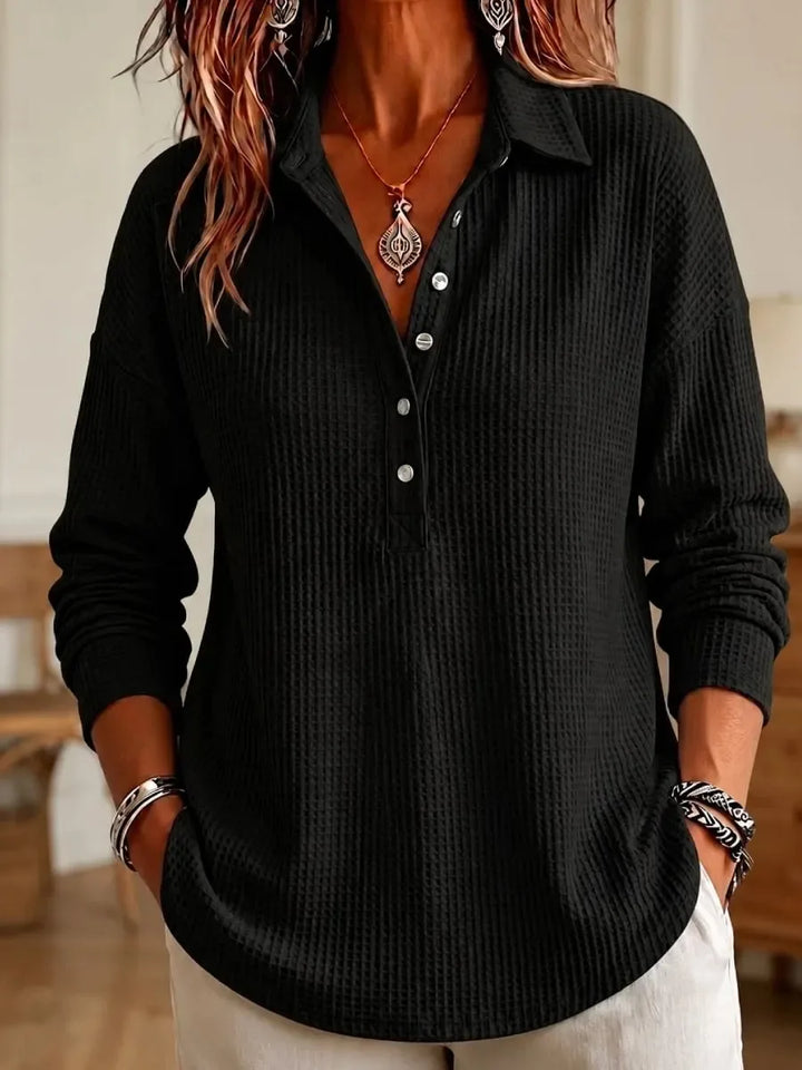 Black waffle knit polo shirt with button placket, front view