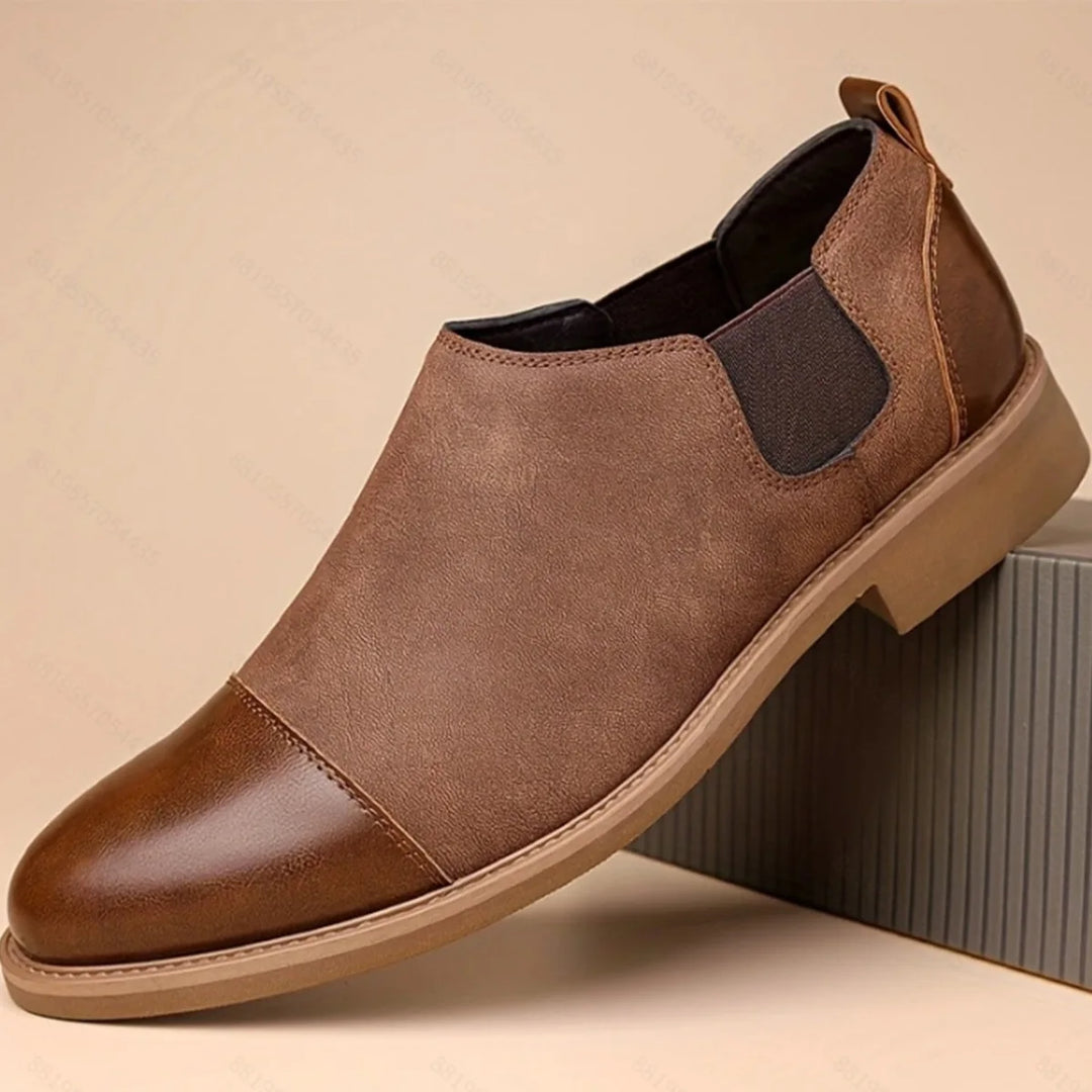 Brown cap toe Chelsea boot, side profile view