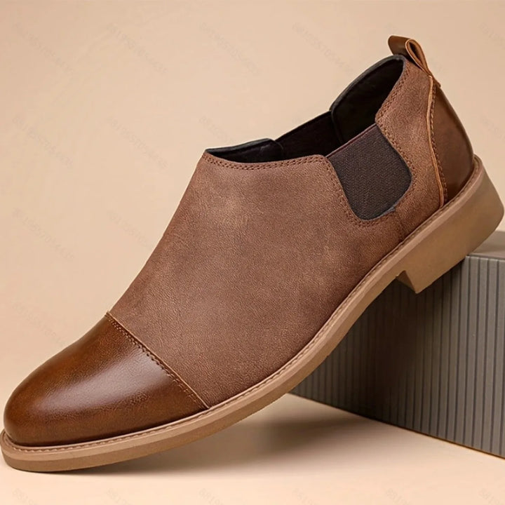 Brown cap toe Chelsea boot, side profile view