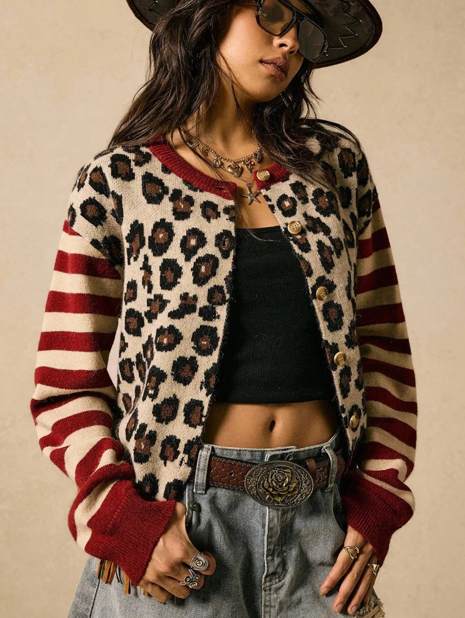 Close up front view of red striped leopard print cardigan sweater with necklace