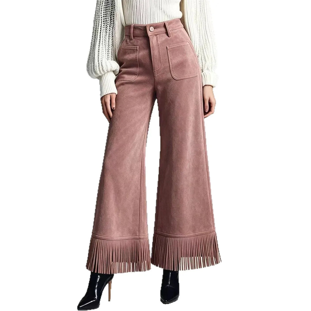 Woman wearing peach suede-look flare pants with fringe hem, front view