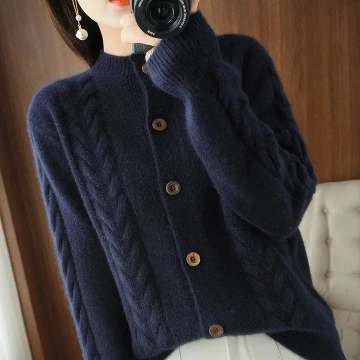 Navy cable knit cardigan with stand collar and buttons
