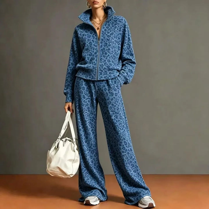 Woman wearing royal blue leopard print zip front jacket and wide leg pants set