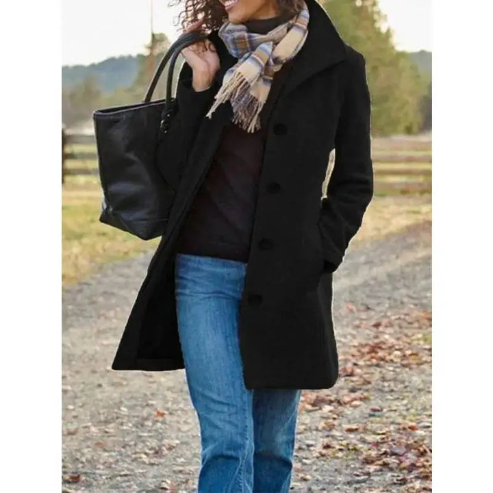 Woman wearing black mid-length wool coat