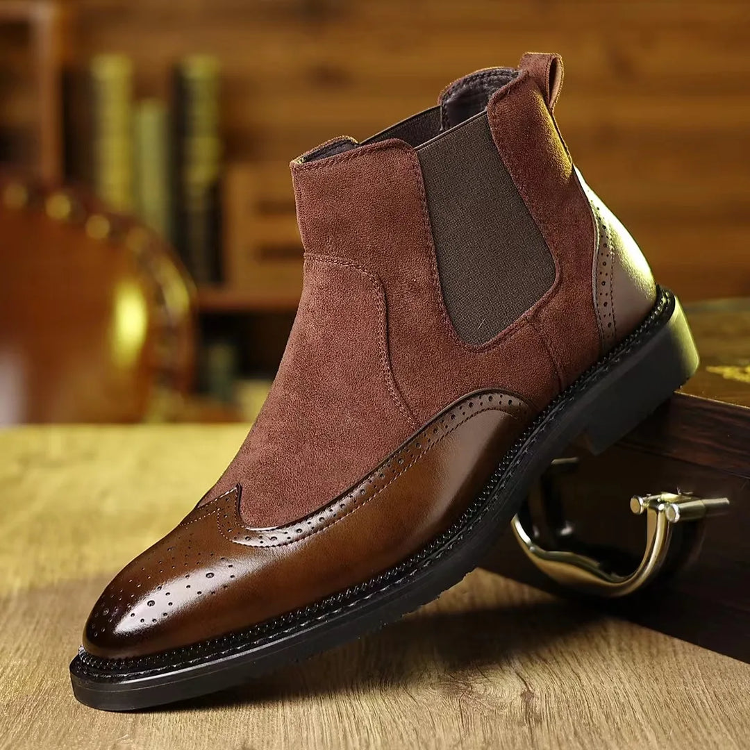 Brown Chelsea boot with wingtip brogue toe, side angle