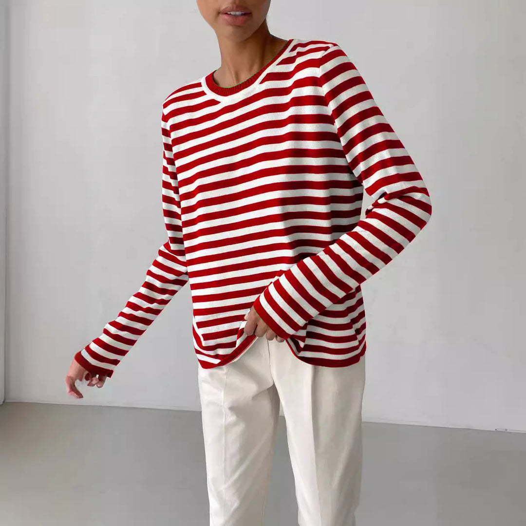 Woman wearing red and white striped knit sweater