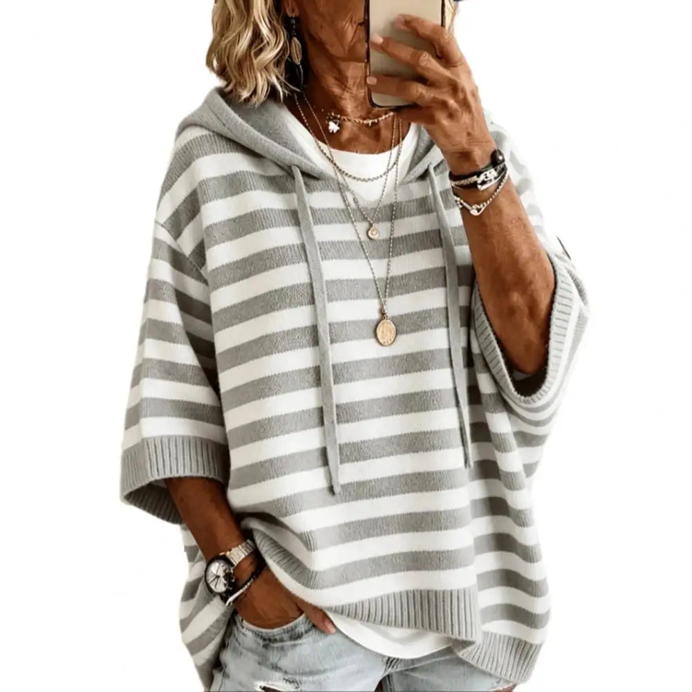 Grey and white striped hooded sweater close up