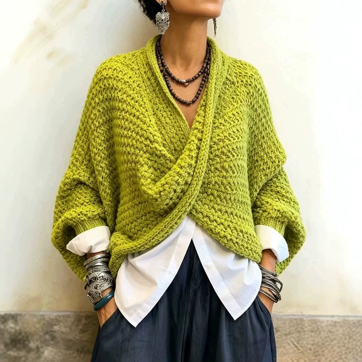 Woman wearing chartreuse green wrap front chunky knit cardigan over white shirt