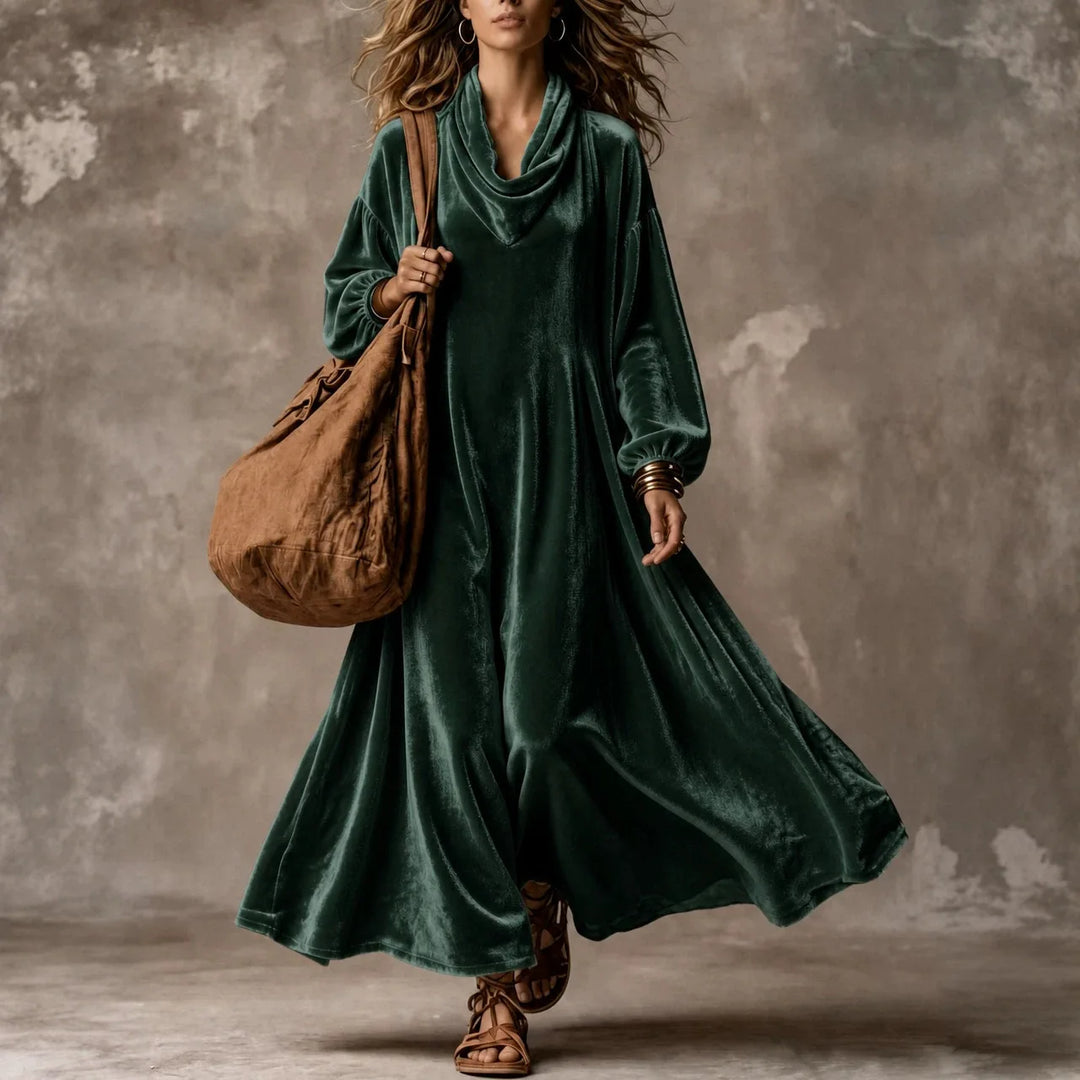 Woman wearing green velvet cowl neck maxi dress