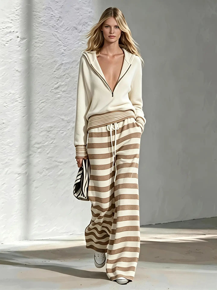 Cream half-zip hoodie with khaki and white striped wide leg pants, front view