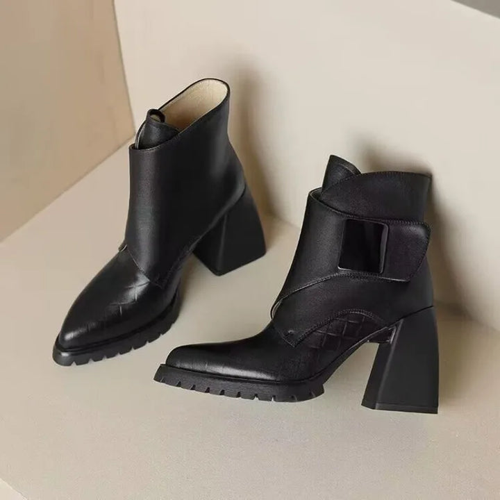 Black ankle boots shown together, side angle