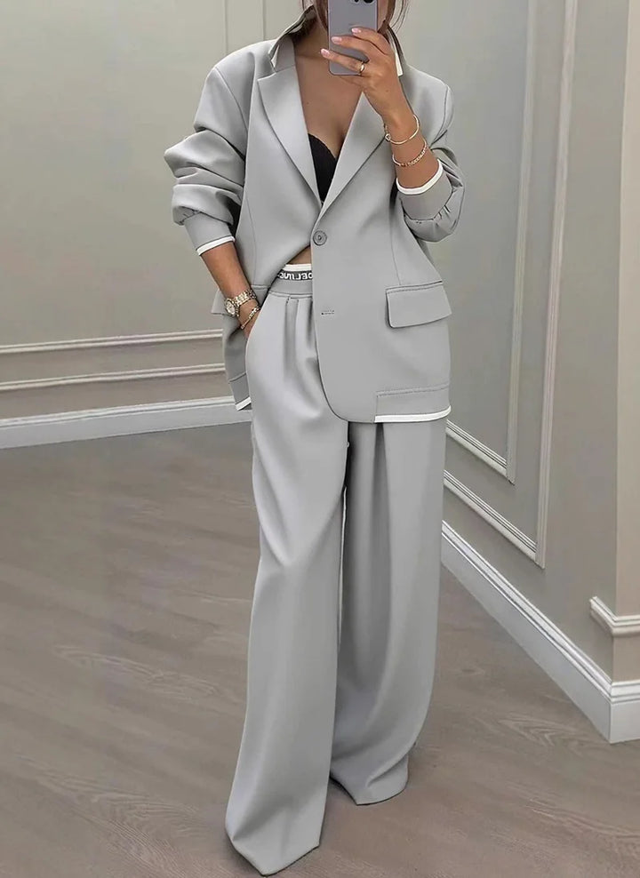 Gray contrast trim blazer and wide leg trouser suit, front view