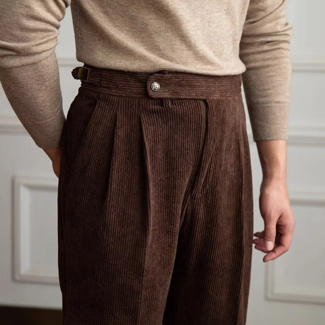 Close up of coffee brown corduroy trousers waistband and pleats