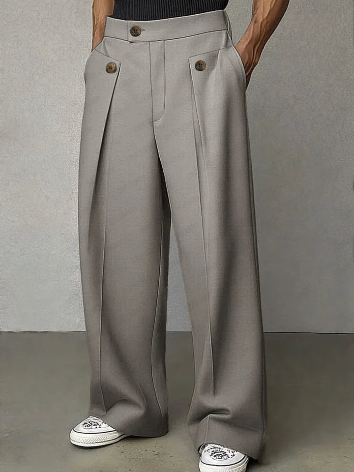 Grey wide leg trousers with button tab pockets, front view