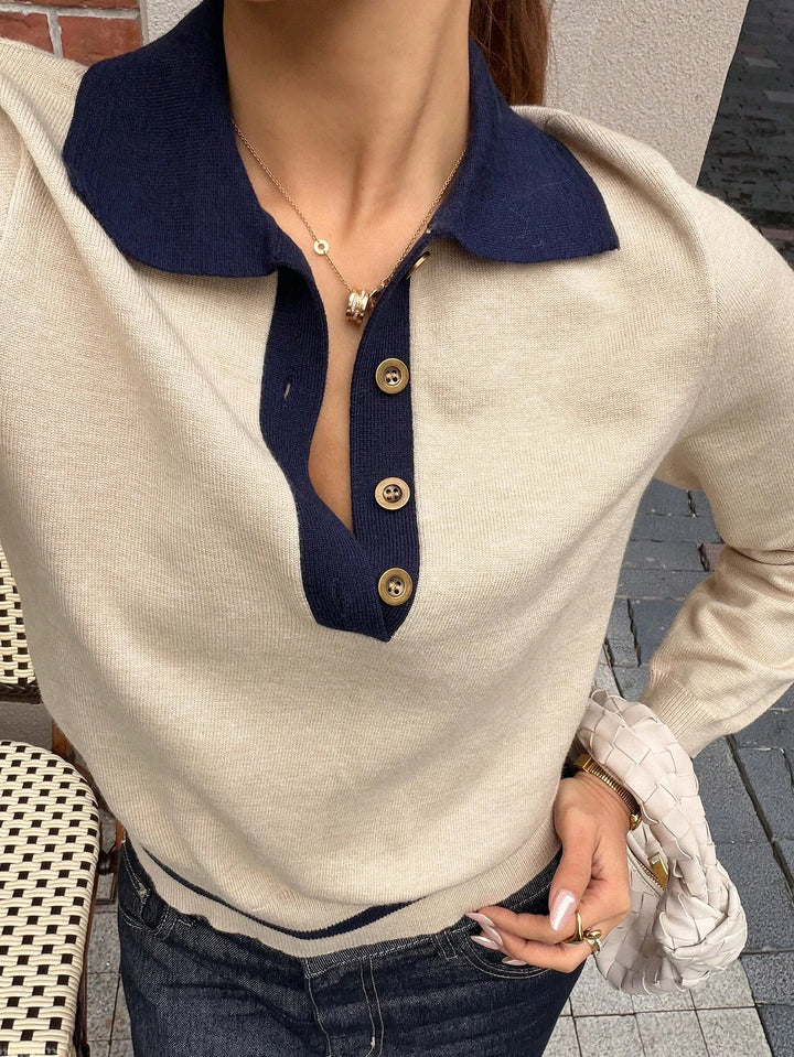Close-up of contrast navy polo collar and button placket on khaki knit top