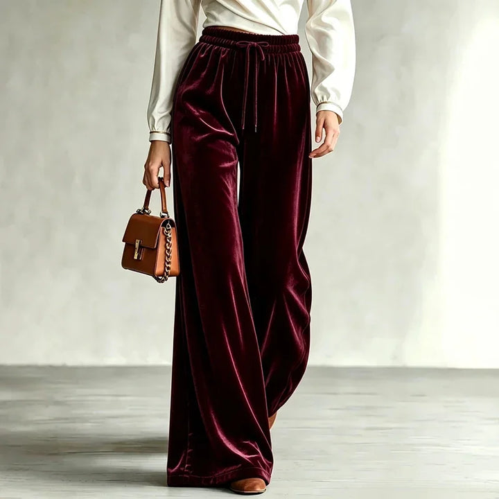 Burgundy velvet wide leg pants with drawstring waist, front view