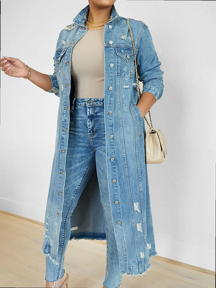 Dark blue distressed denim trench coat styled with jeans