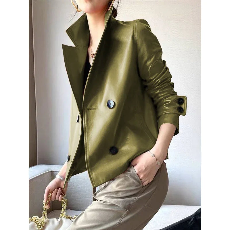 Model wearing green faux leather cropped jacket, side view