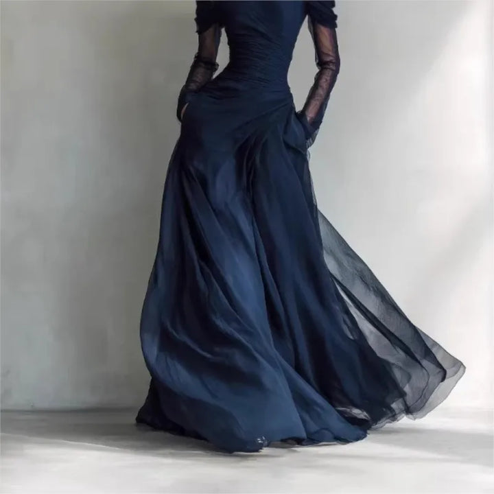 Navy blue evening gown skirt detail, flowing fabric