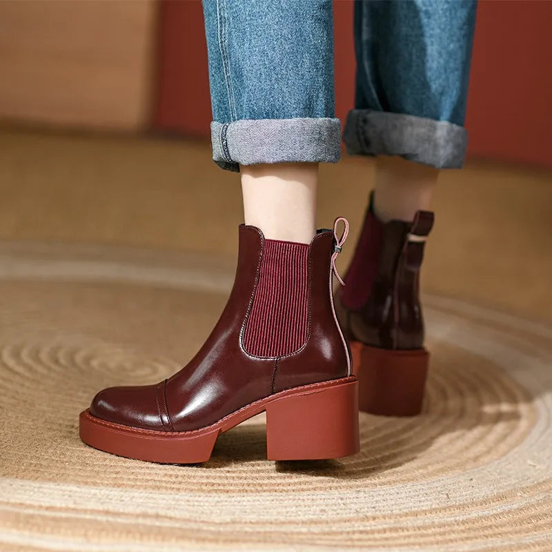 Close view of wine red Chelsea boot side elastic panel
