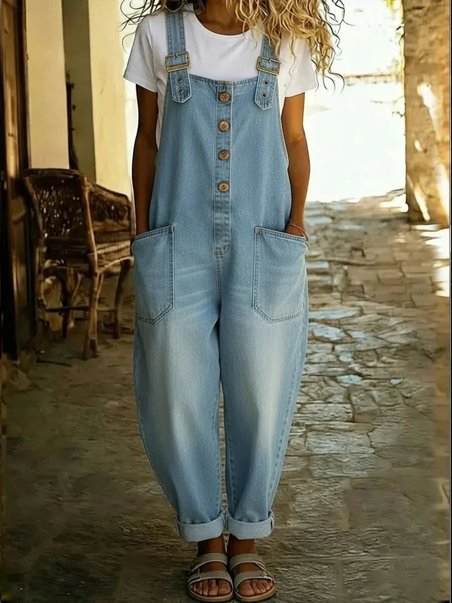 Light blue denim overalls with adjustable buckle straps and rolled cuffs