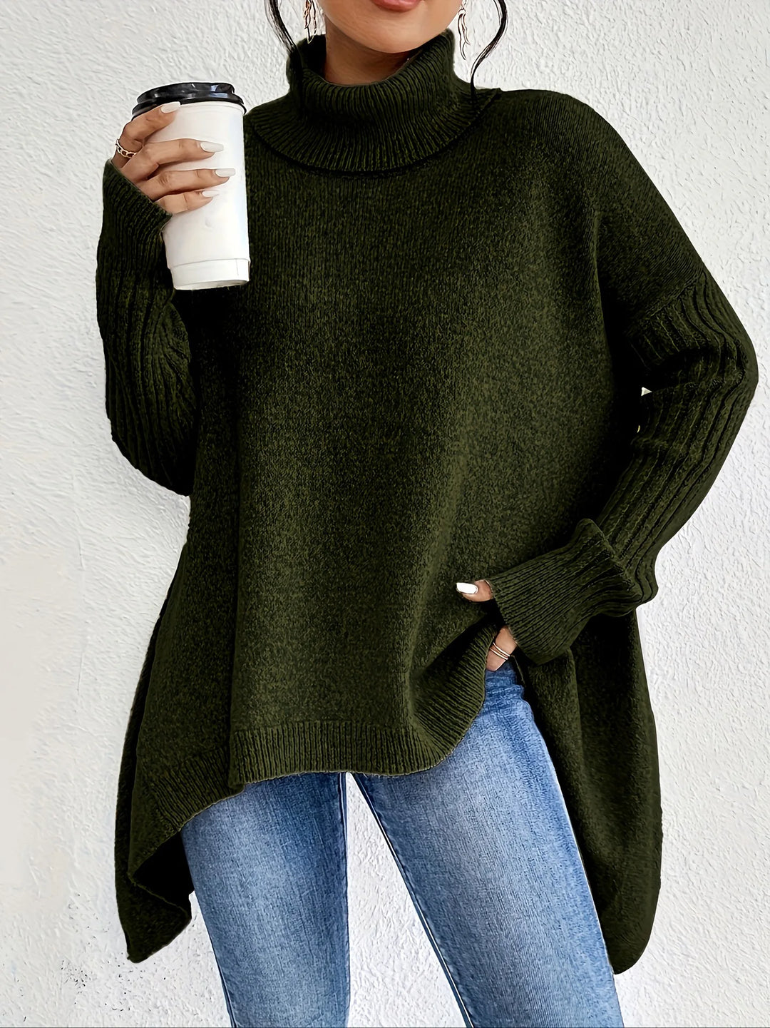 Woman wearing dark green oversized turtleneck sweater