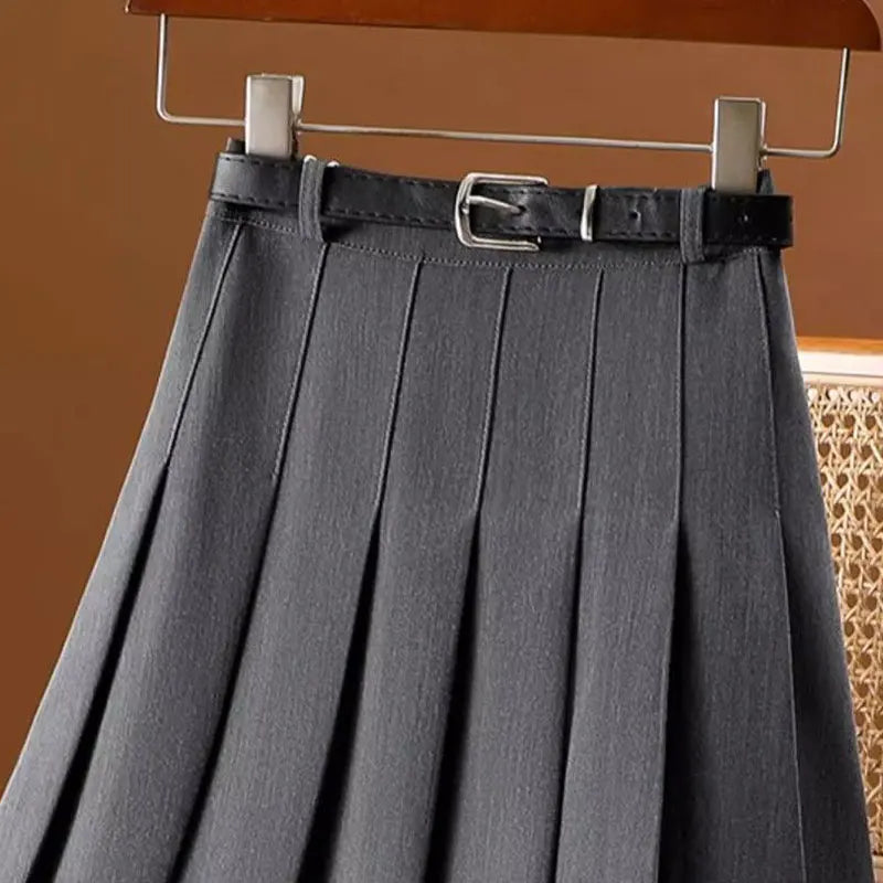 Close up of gray pleated skirt waistband and belt