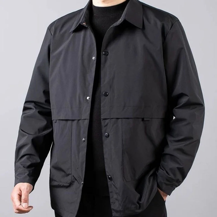 Man wearing black shirt jacket, close front view