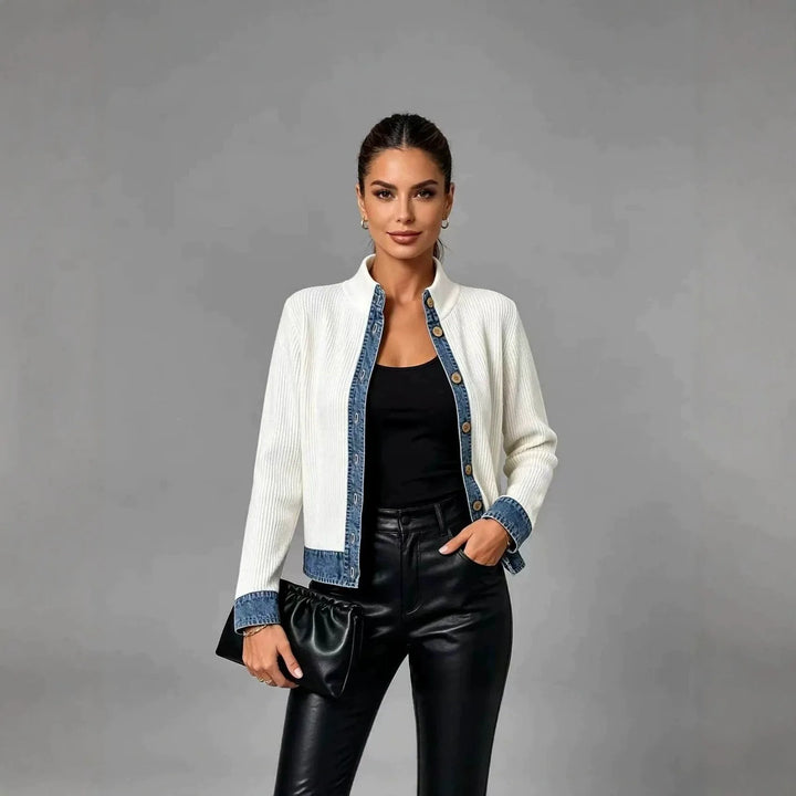 Woman wearing white ribbed cardigan with denim trim, front view