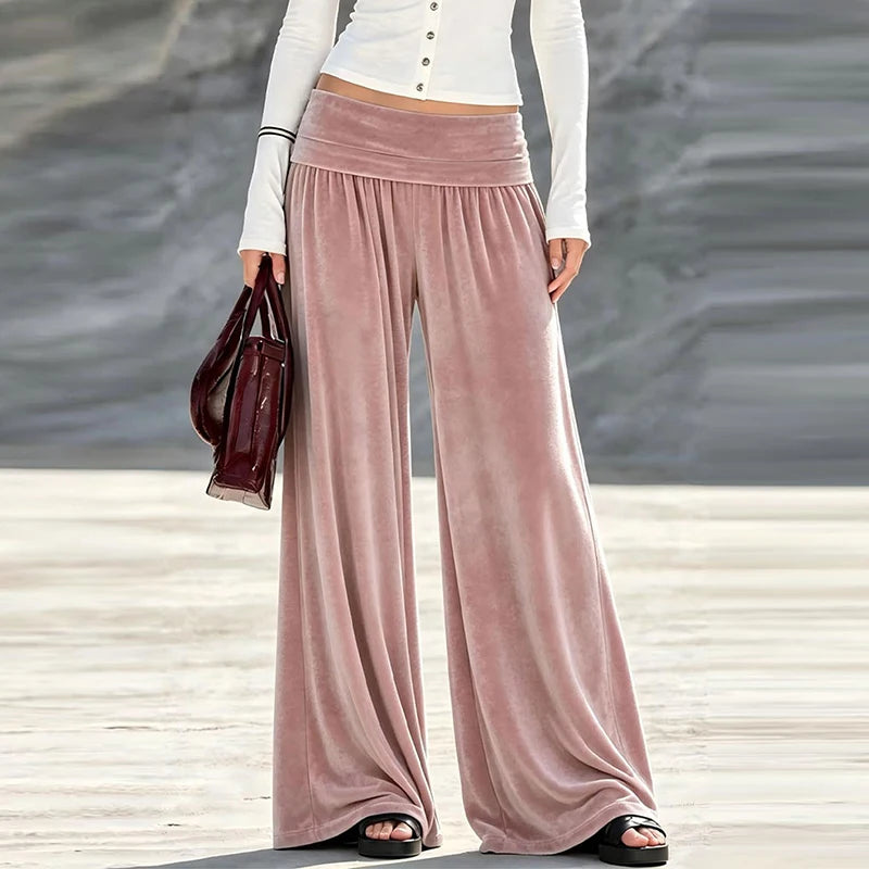 Woman wearing dusty pink velvet wide leg high waist pants, front view