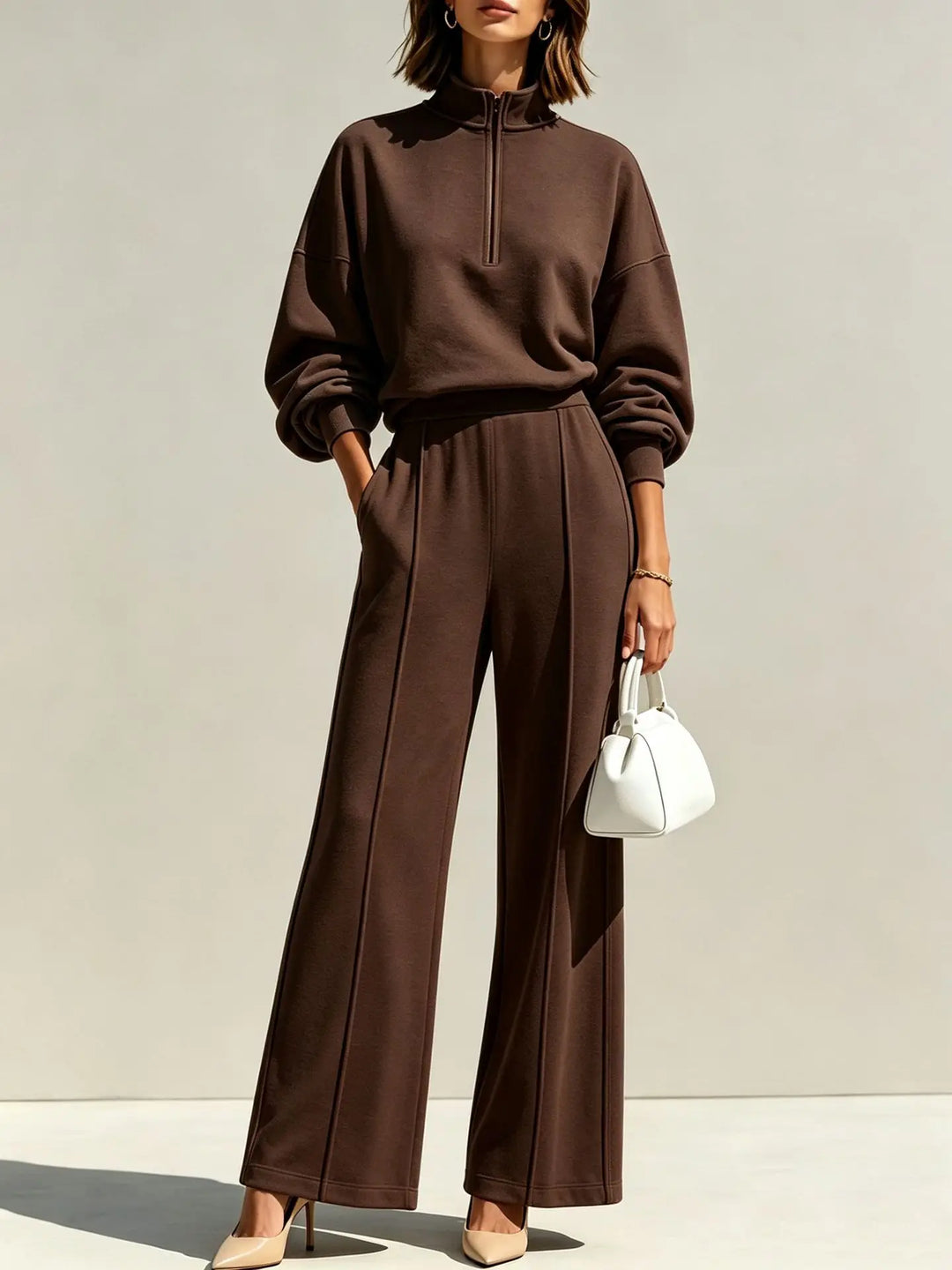 Close view of coffee brown half zip pullover and wide leg pants set