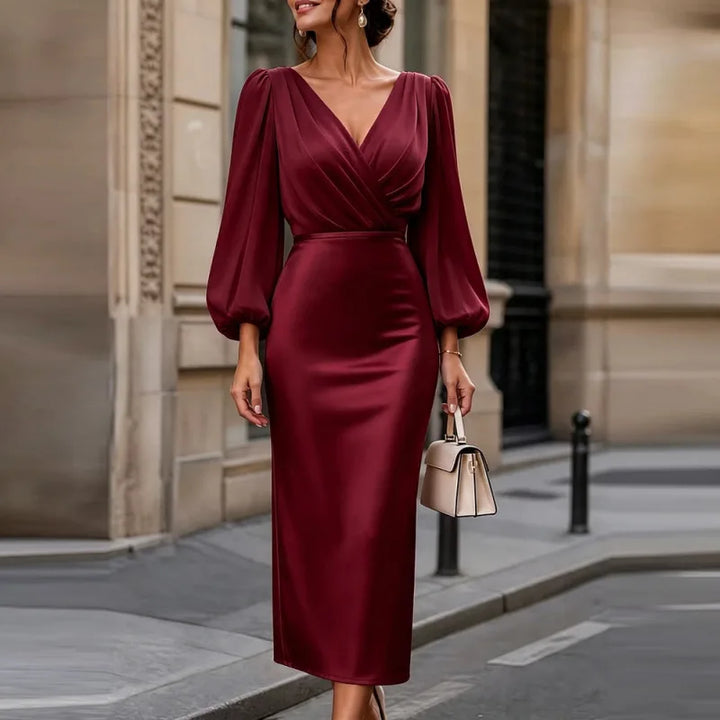 Woman wearing burgundy wrap front satin midi dress with lantern sleeves