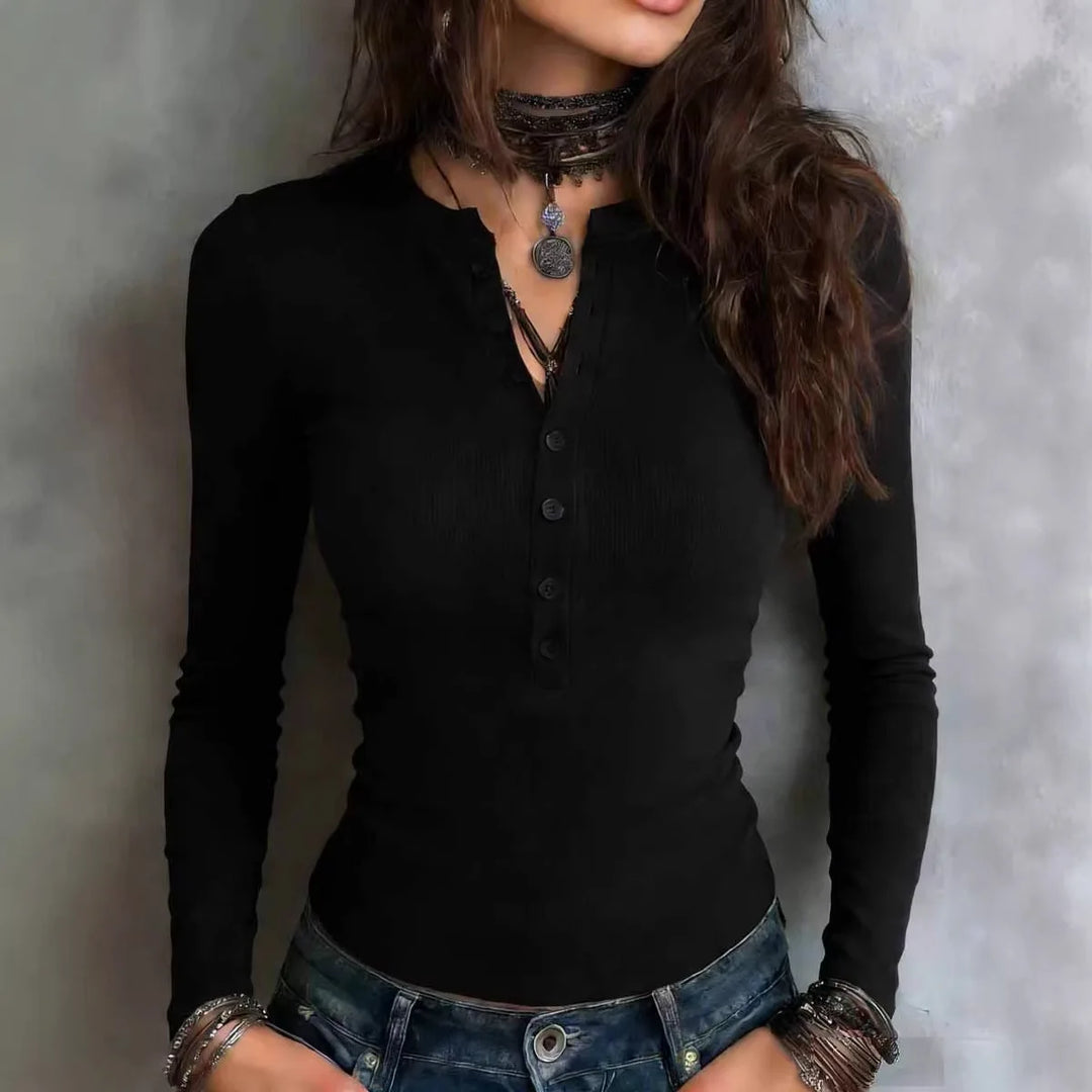 Woman wearing black ribbed henley long sleeve top with button placket