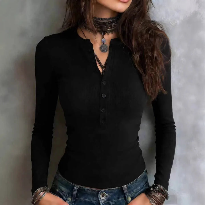 Woman wearing black ribbed henley long sleeve top with button placket