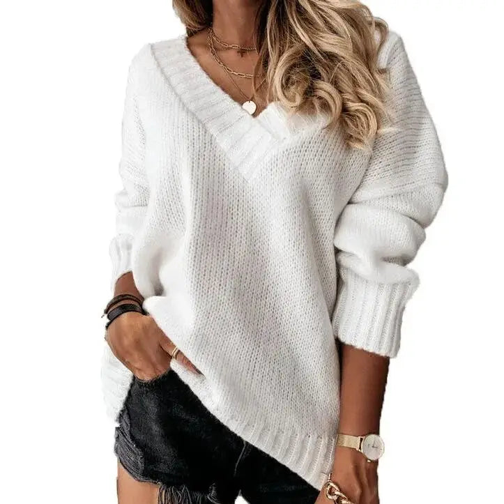 Woman wearing white V-neck knit sweater