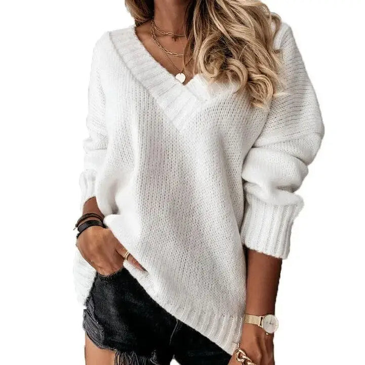 Woman wearing white V-neck knit sweater