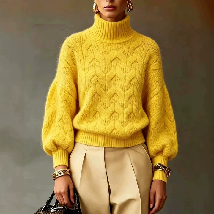 Woman wearing bright yellow cable knit turtleneck sweater with lantern sleeves