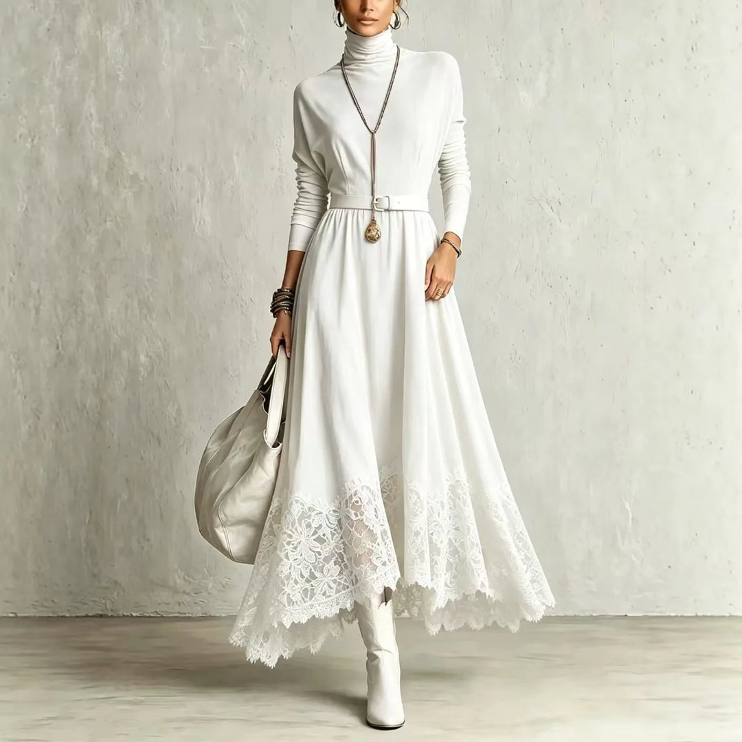 Woman wearing white turtleneck maxi dress with lace hem