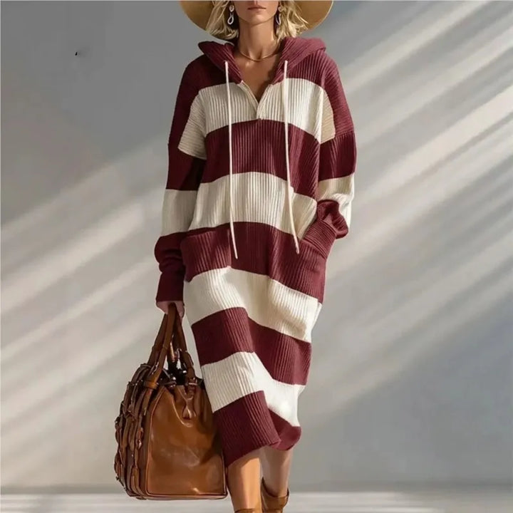 Woman wearing claret and cream striped hooded sweater dress