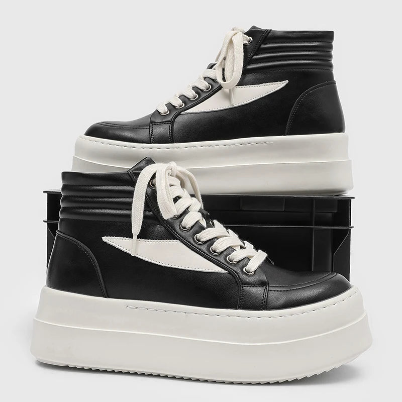 Side profile of black and white high top platform sneakers stacked