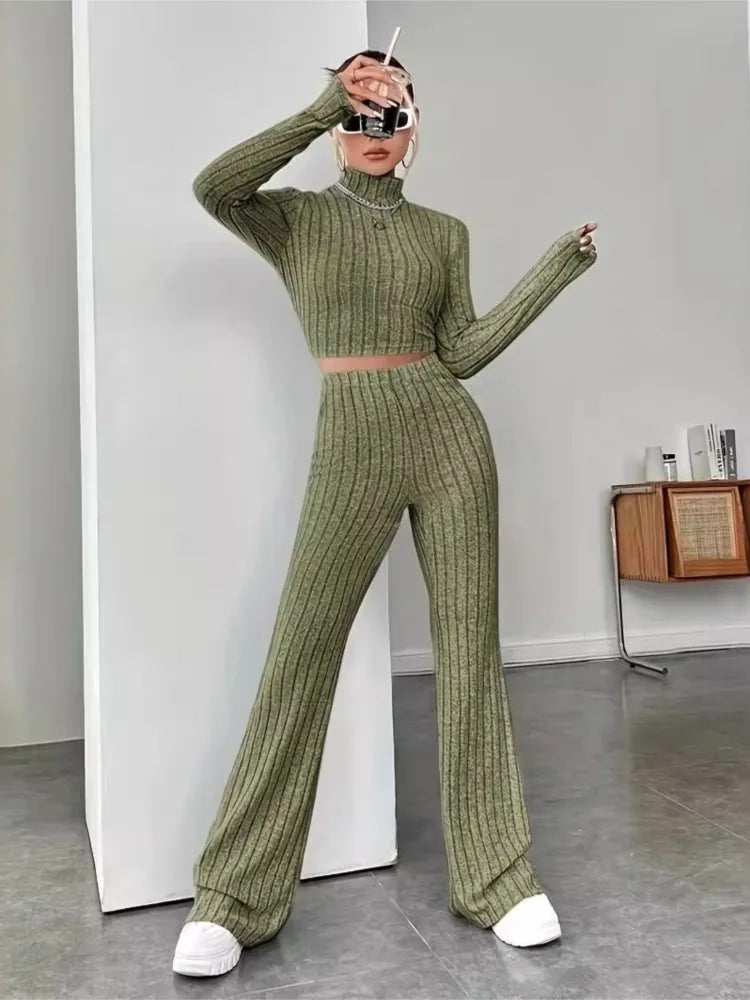 Woman wearing army green ribbed knit crop top and flare pants set