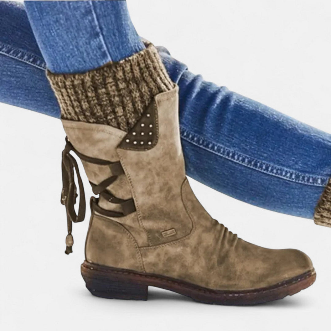 Close up of khaki suede winter boot with knit cuff and lace detail