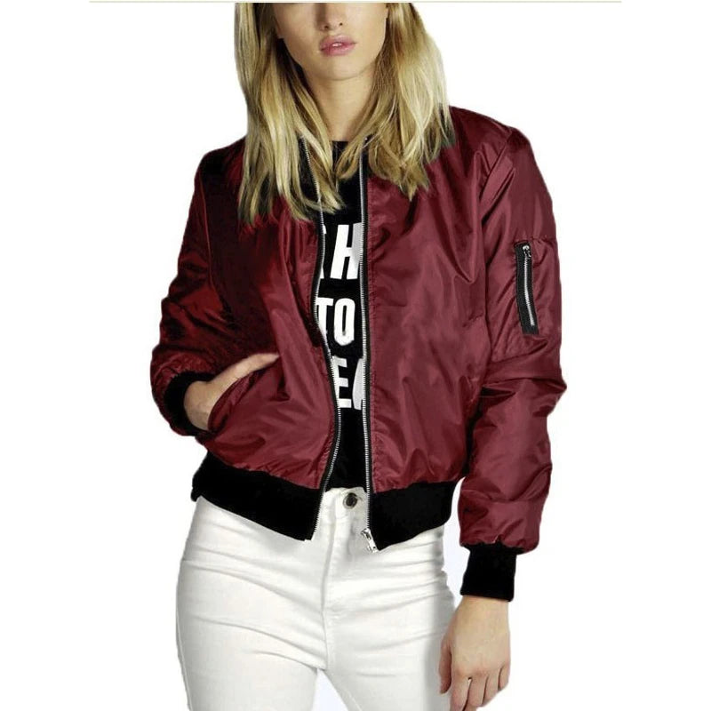 Woman wearing wine red bomber jacket, front view